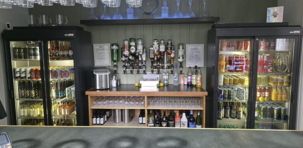 Fully stocked licensed bar at Beverley Road Masonic Hall, displaying spirits, bottled drinks and refreshments.