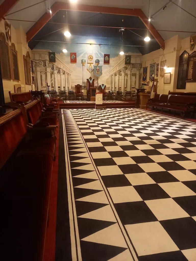 Interior of the Large Lodge Room at Beverley Road Masonic Hall in Hull, featuring traditional Masonic furnishings and a black-and-white chequered floor.