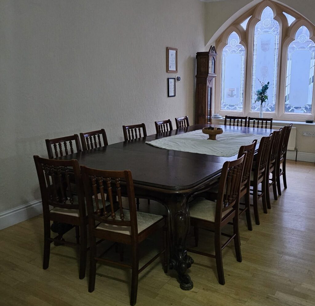 Meeting room at Beverley Road Masonic Hall in Hull, featuring a long conference table and chairs.